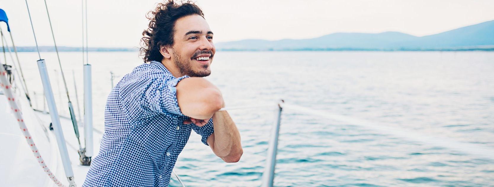 A Patelco member enjoys the view from his sailboat.